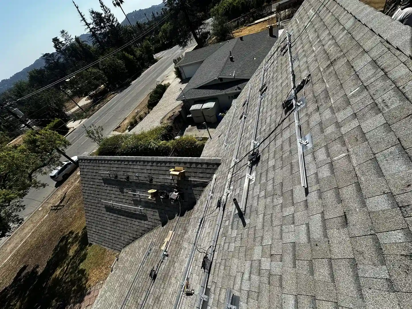 Solar panel racking and standoffs installed on Altadena residential rooftop before panel placement