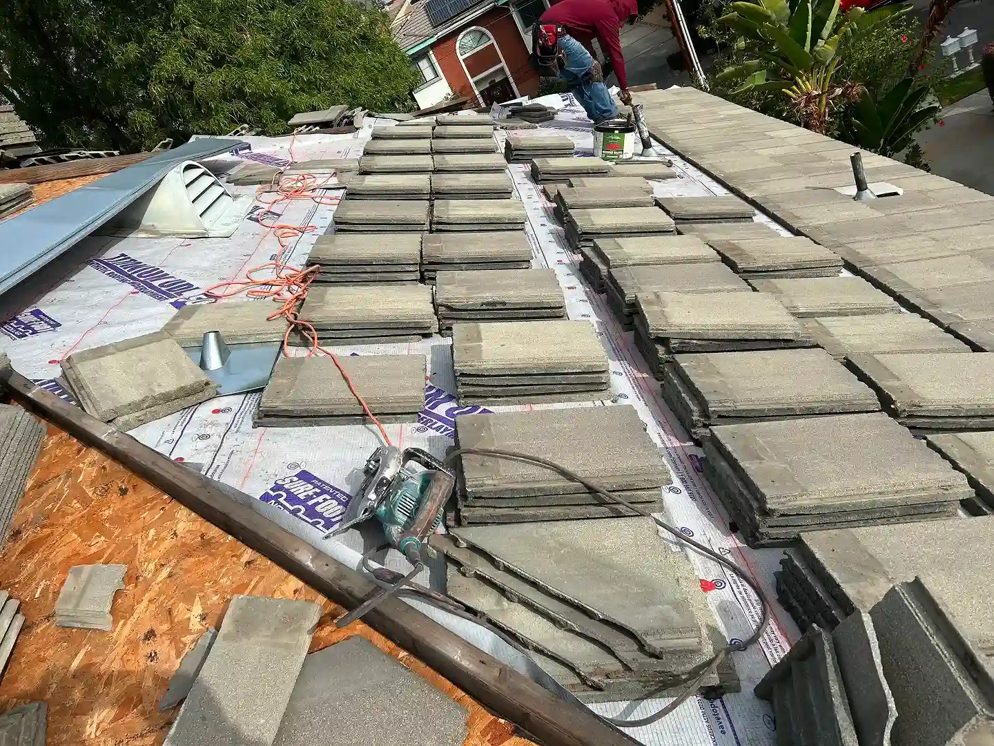 Cali Energy crew working on residential roof in Arcadia