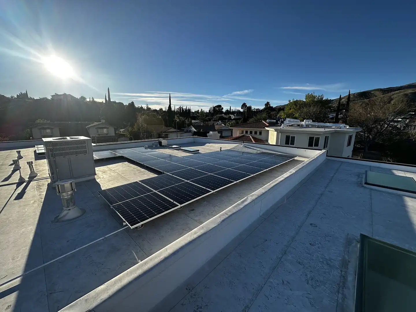 Completed 31-panel SolarEdge solar installation on flat roof, Porter Ranch CA