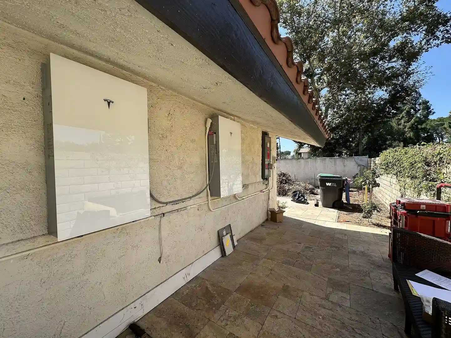 Tesla Powerwall 3 with Expansion Pack and upgraded service panel on home exterior wall, Westlake Village CA