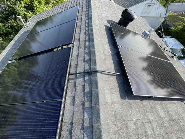 Solar panel mounting detail on a composition shingle roof in Altadena, CA
