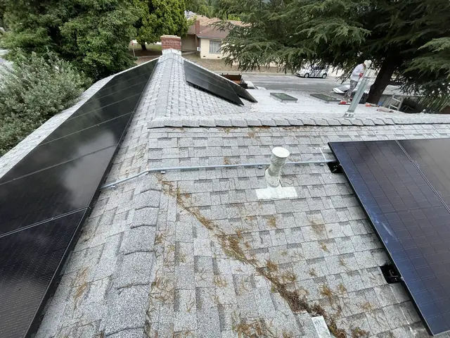 Solar panel mounting detail on a composition shingle roof in Altadena, CA