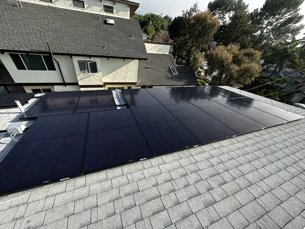 Solar panel mounting detail on a composition shingle roof in Altadena, CA