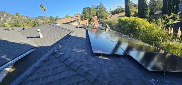 Solar panel mounting detail on a composition shingle roof in Altadena, CA