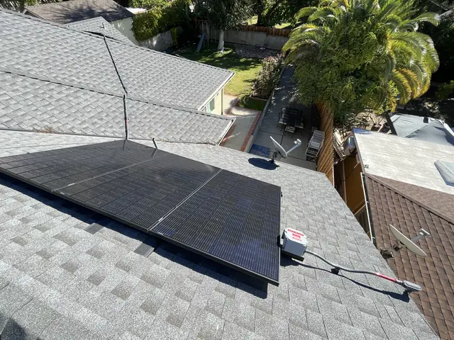 Solar panel mounting detail on a composition shingle roof in Altadena, CA
