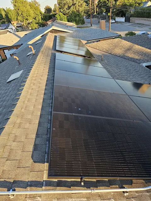 Solar panel mounting detail on a composition shingle roof in Altadena, CA