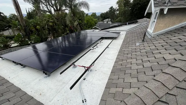 Solar panel mounting detail on a composition shingle roof in Altadena, CA