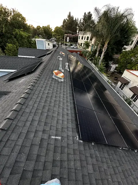 Solar panel mounting detail on a composition shingle roof in Burbank, CA