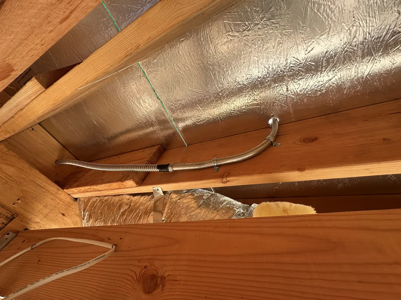 Electrical conduit running through open wood framing in a Burbank house under construction