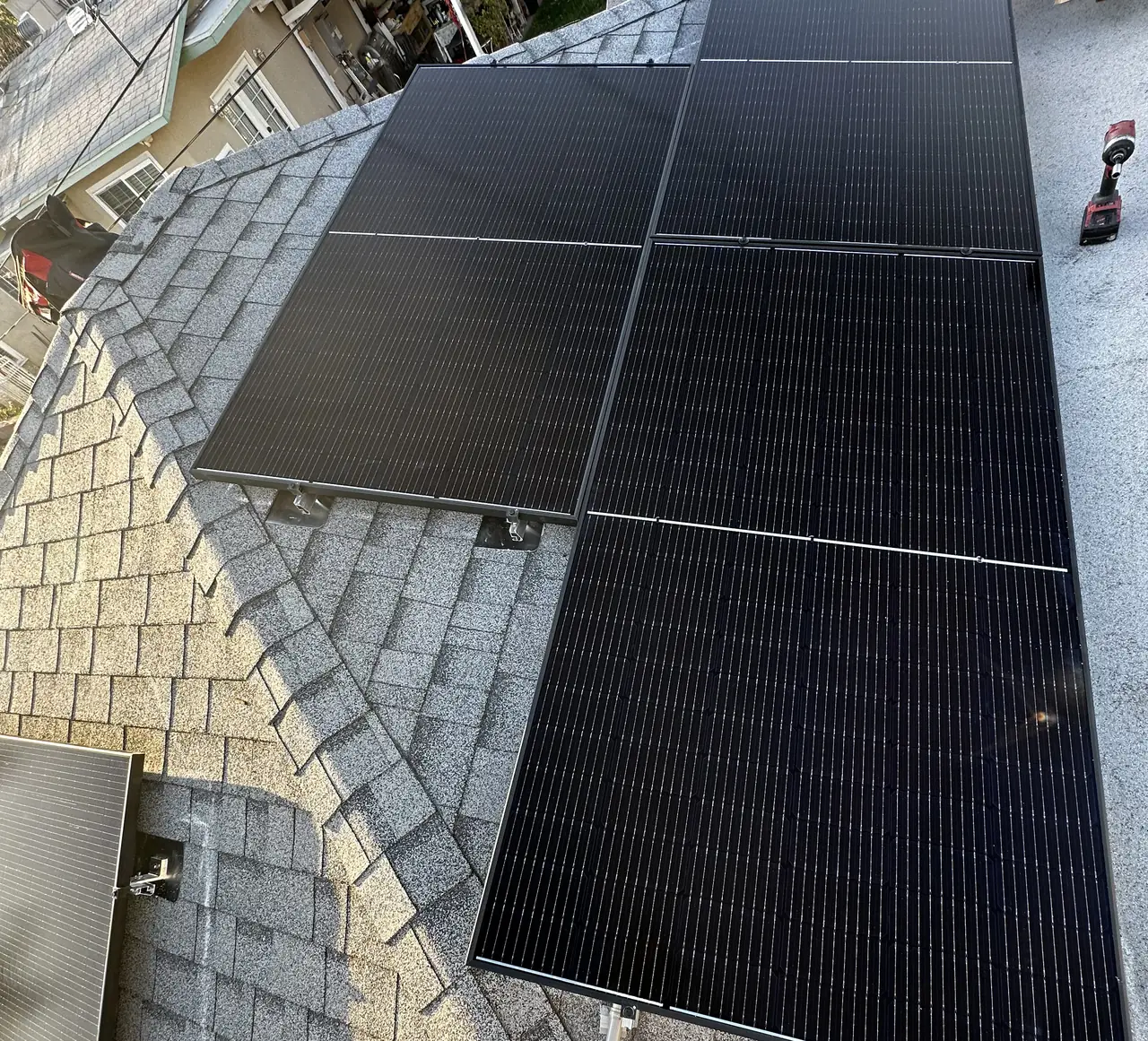 Solar modules installed across two adjacent planes of a shingle roof in Burbank