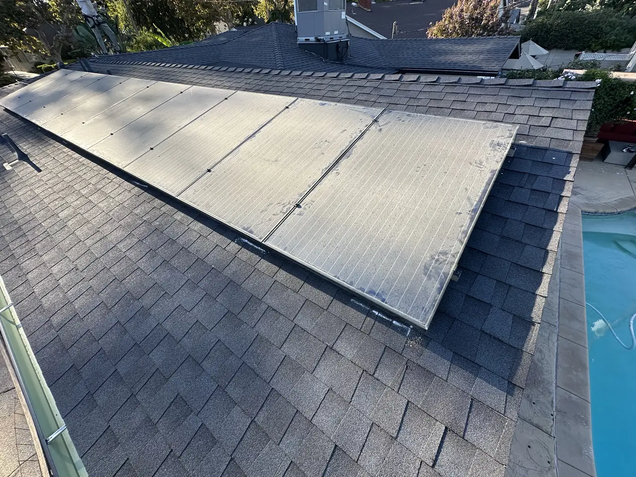 The roof outlived its felt. The array came off and went back