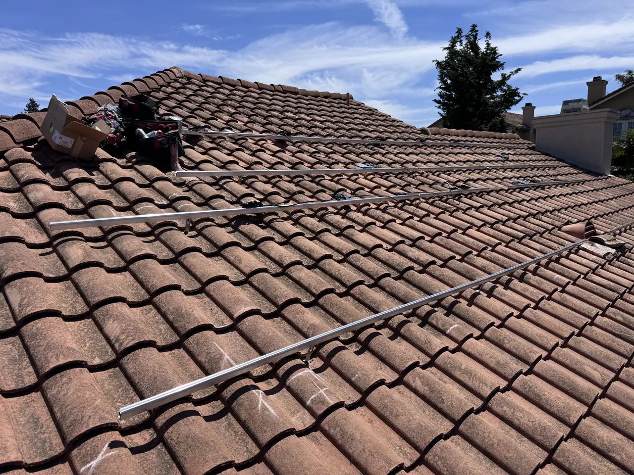 All-black solar array on a clay barrel-tile roof in Camarillo