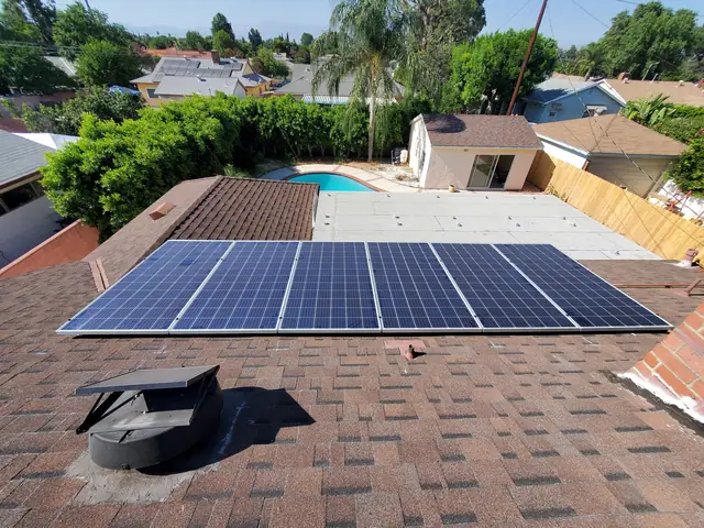Solar panel mounting detail on a composition shingle roof in Canoga Park, CA