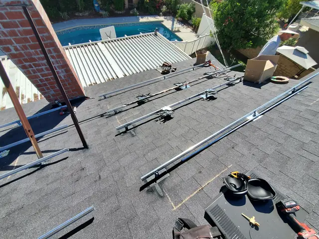 Solar panel mounting detail on a composition shingle roof in Canoga Park, CA