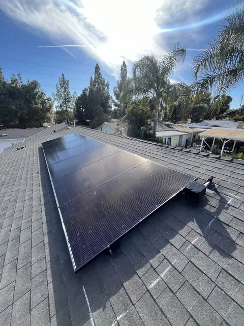 Solar panel mounting detail on a composition shingle roof in Canoga Park, CA
