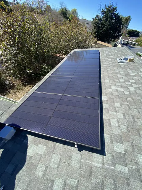 Solar panel mounting detail on a composition shingle roof in Canoga Park, CA