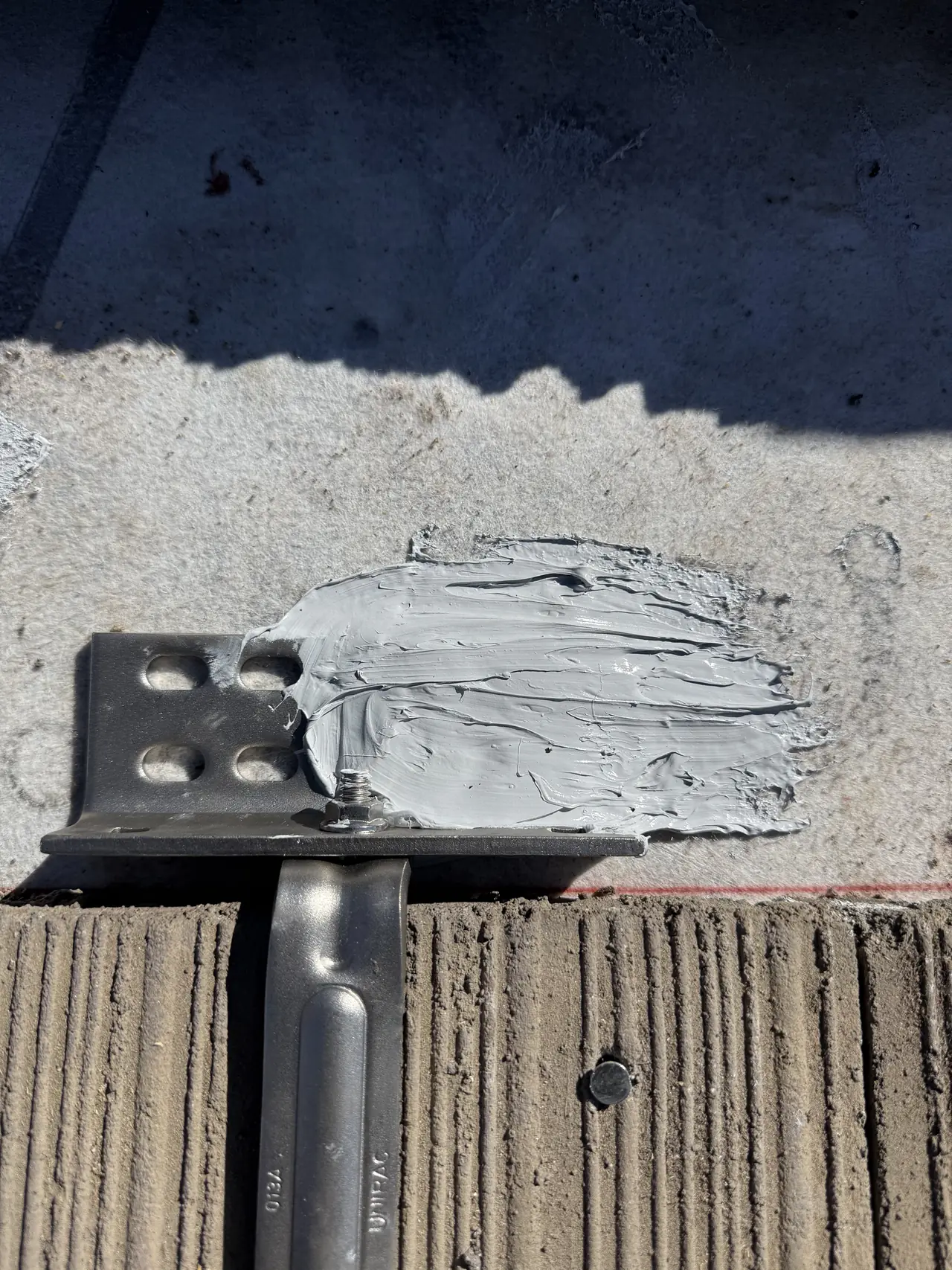 Mount base sealed to the new underlayment with tile cut away around it, Canoga Park