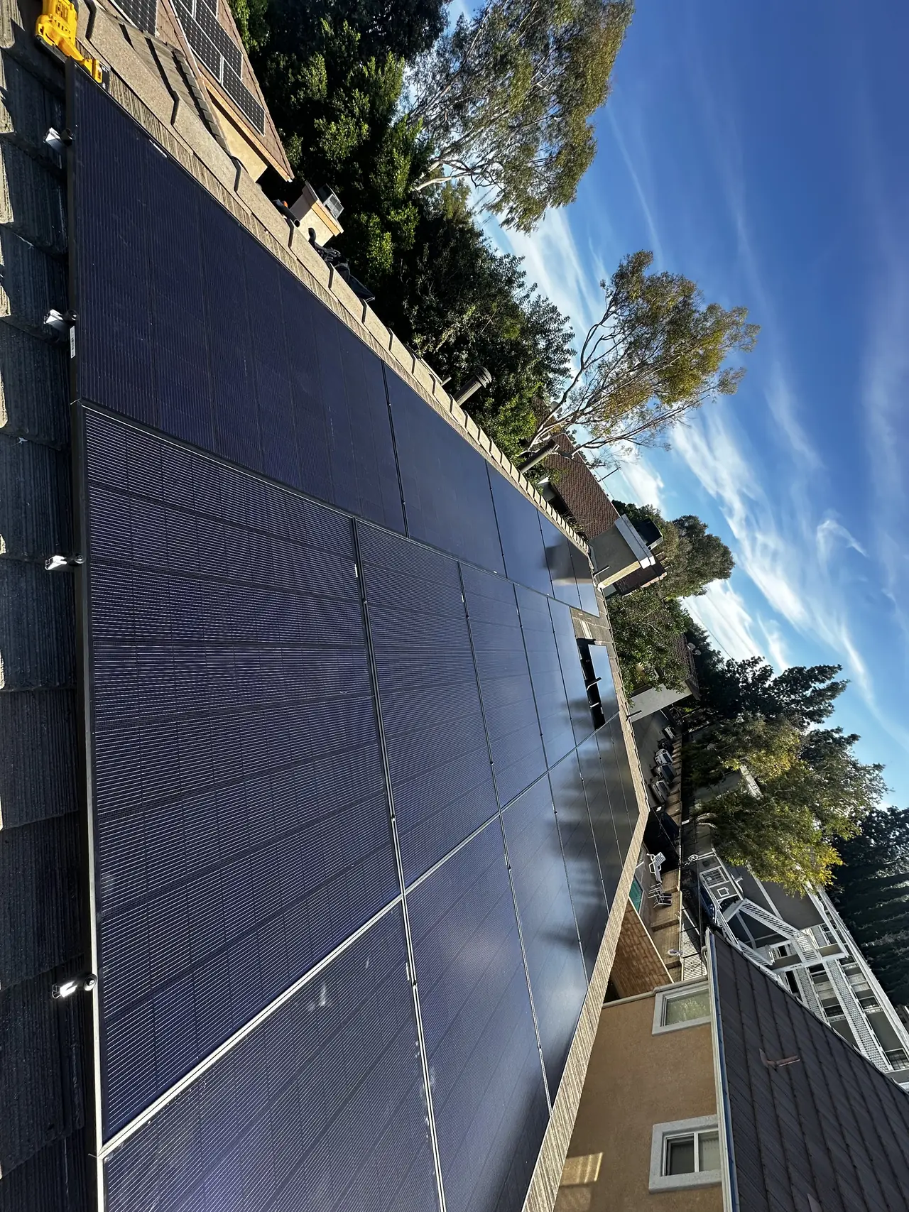 Finished solar array over flat concrete tile seen along the slope, Canoga Park