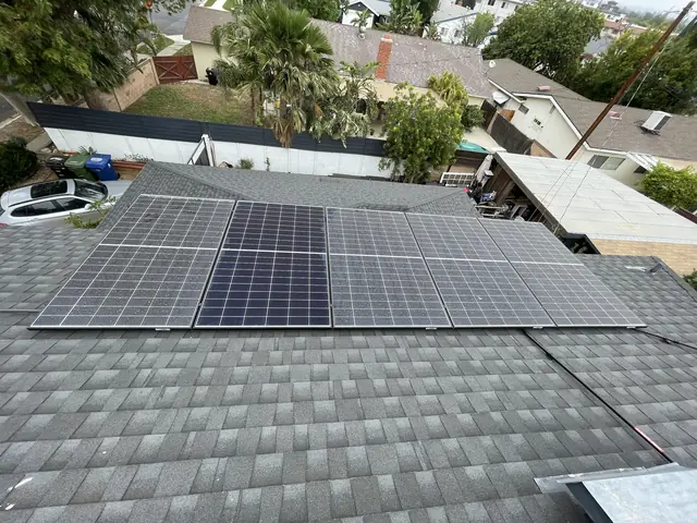 Solar modules across two planes of a composition shingle roof, Chatsworth