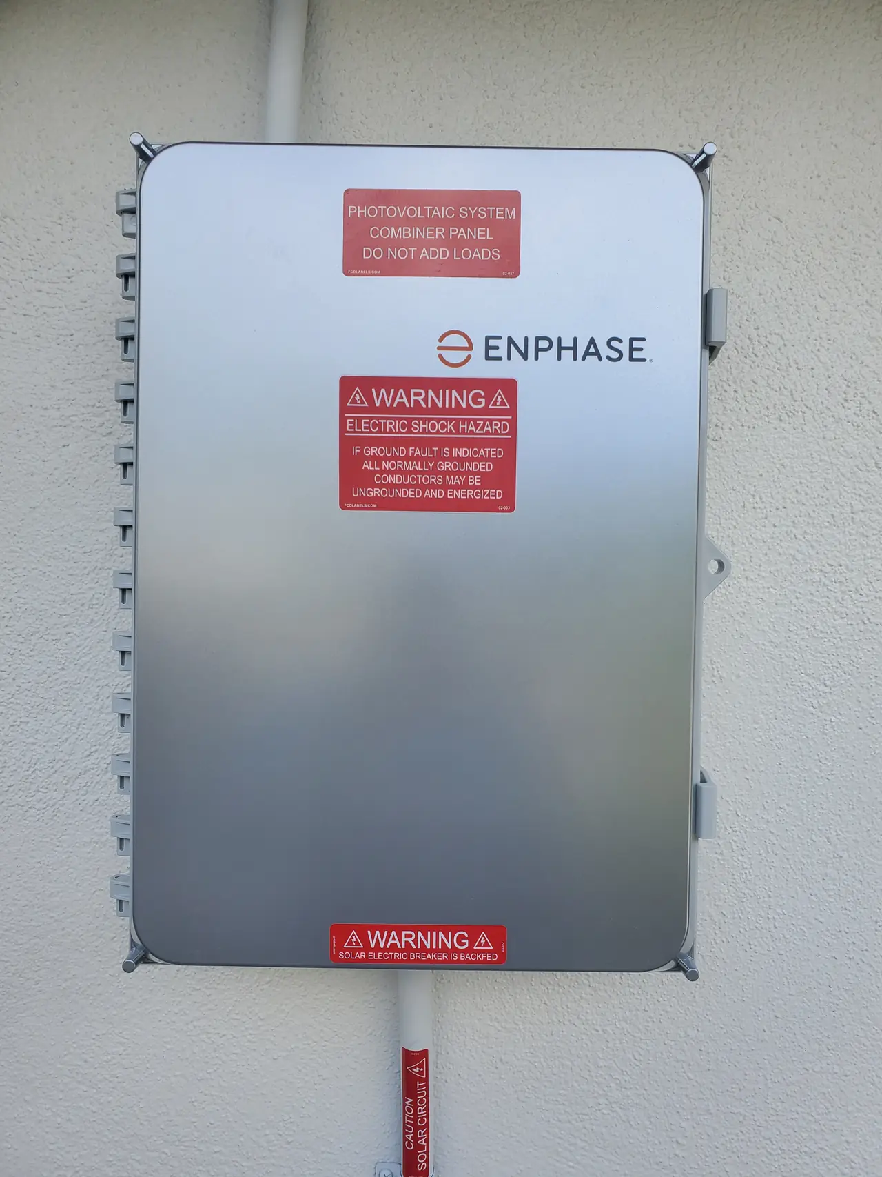 Enphase combiner enclosure mounted on an exterior wall, Chatsworth