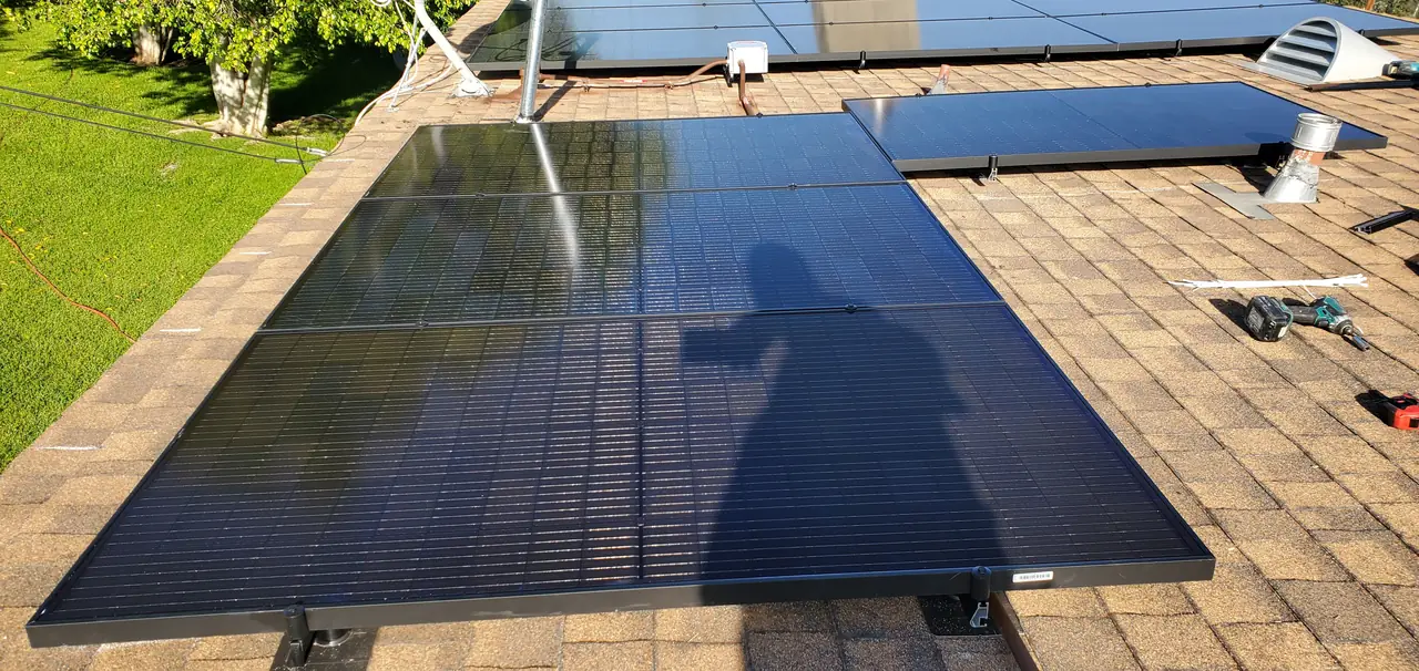 Solar panel mounting detail on a composition shingle roof in Covina, CA