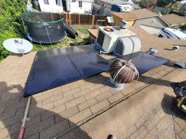 Solar panel mounting detail on a composition shingle roof in Covina, CA