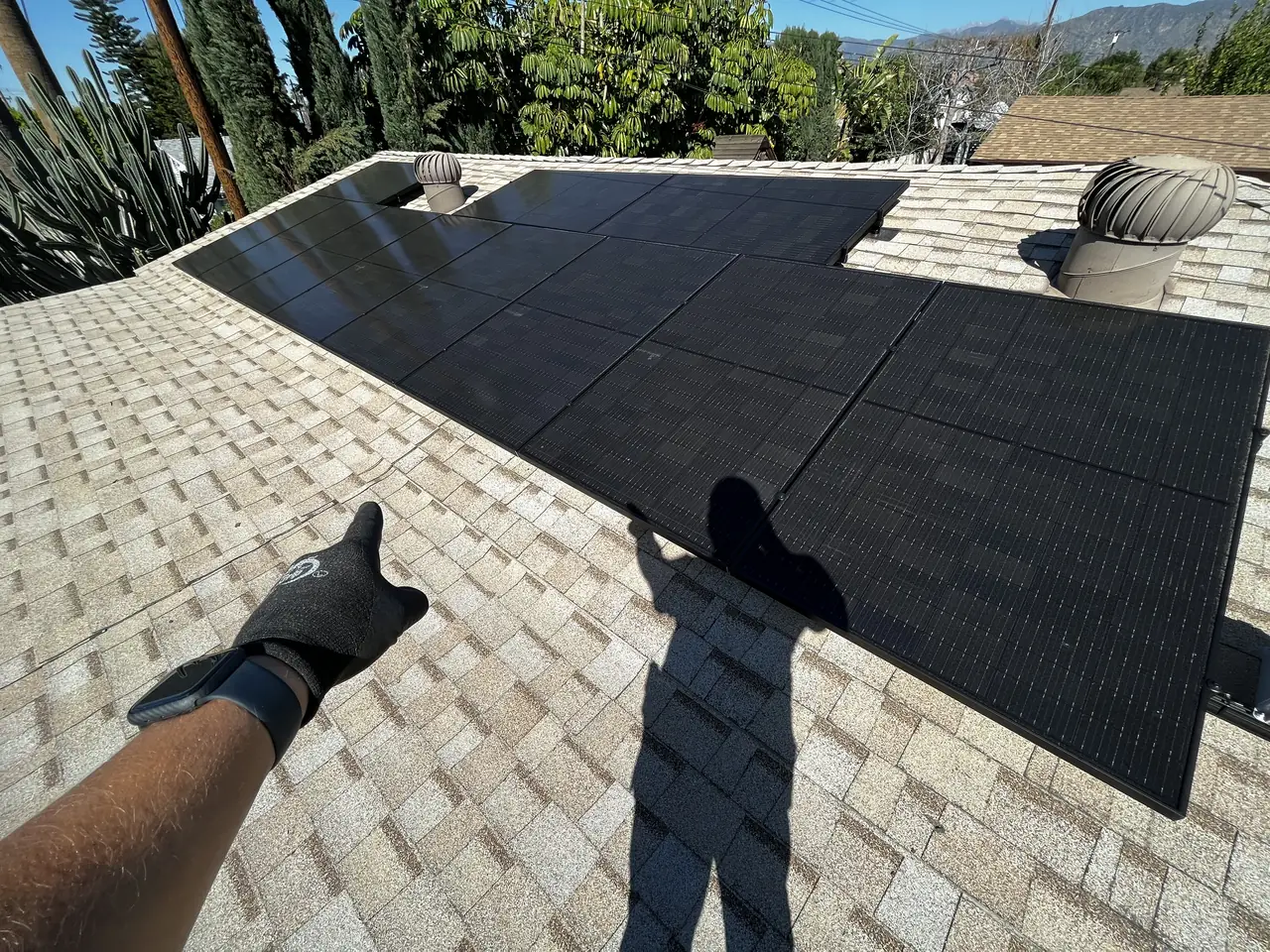 Solar panel mounting detail on a composition shingle roof in Covina, CA
