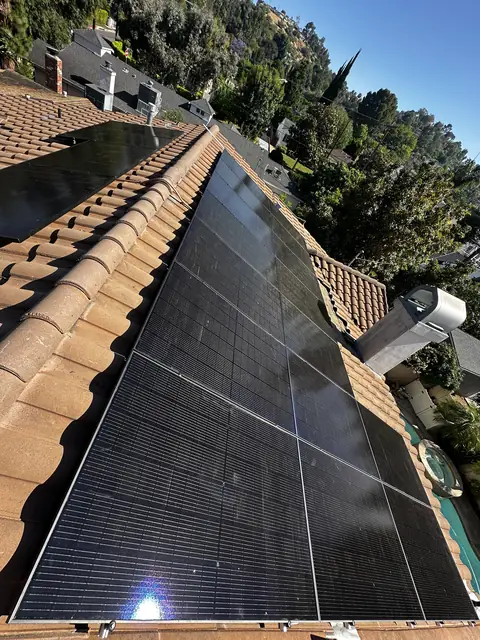 Solar panel mounting detail on a tile roof in Encino, CA