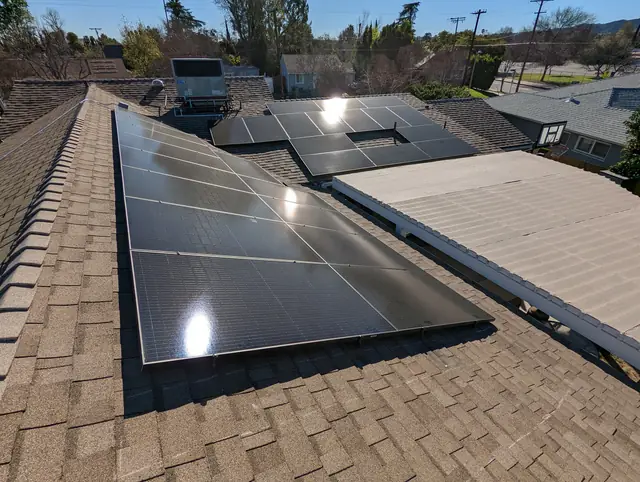Solar panel mounting detail on a composition shingle roof in Encino, CA