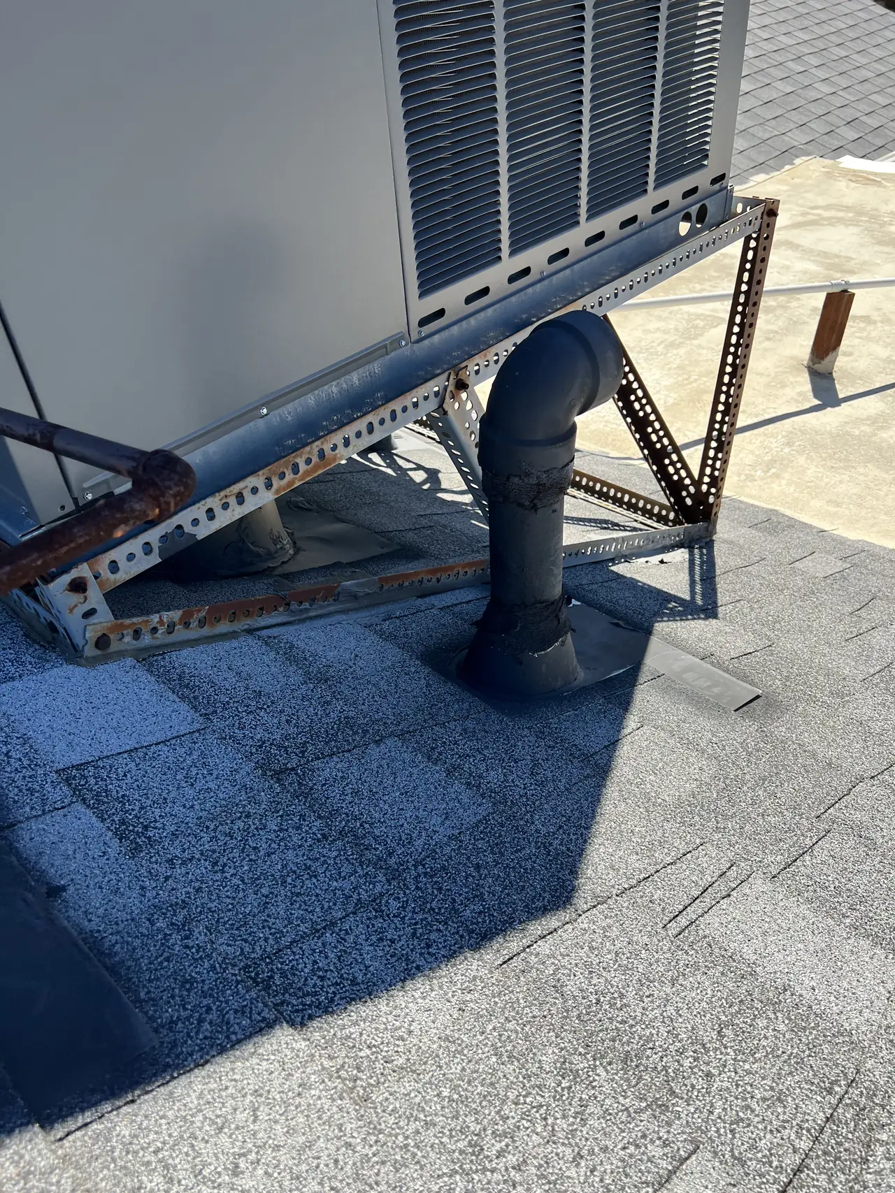 Tilt frame leg and flashed roof penetration on a low-slope roof, Encino