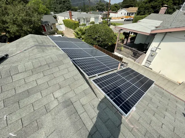 Solar panel mounting detail on a composition shingle roof in Glendale, CA