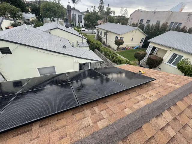 Solar panel mounting detail on a composition shingle roof in Glendale, CA