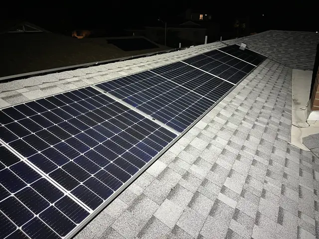 Solar panel mounting detail on a composition shingle roof in Glendale, CA