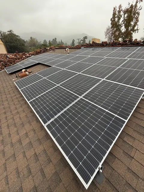 Solar panel mounting detail on a composition shingle roof in Glendale, CA