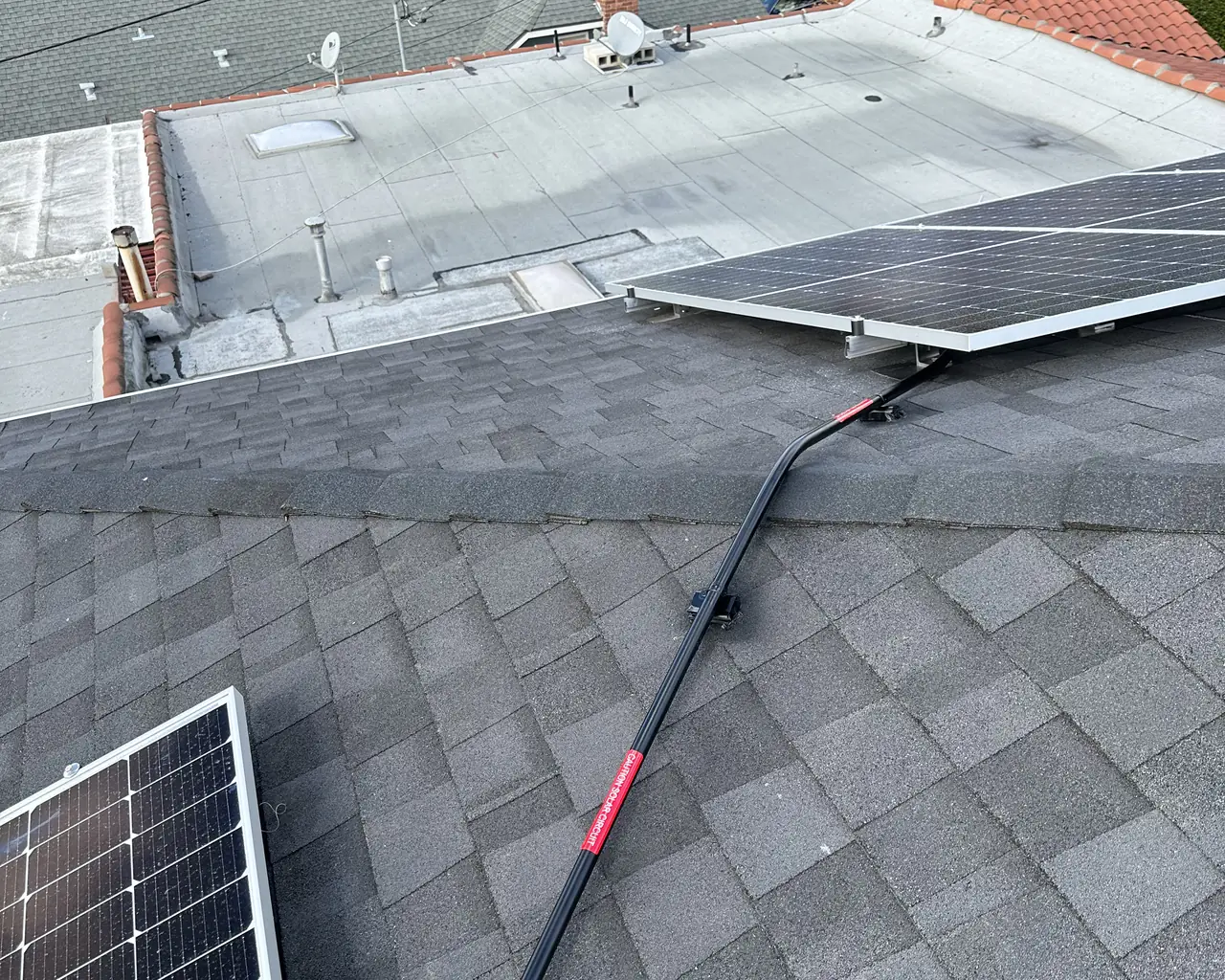 Conduit crossing the ridge of a shingle roof between two groups of modules, Glendale