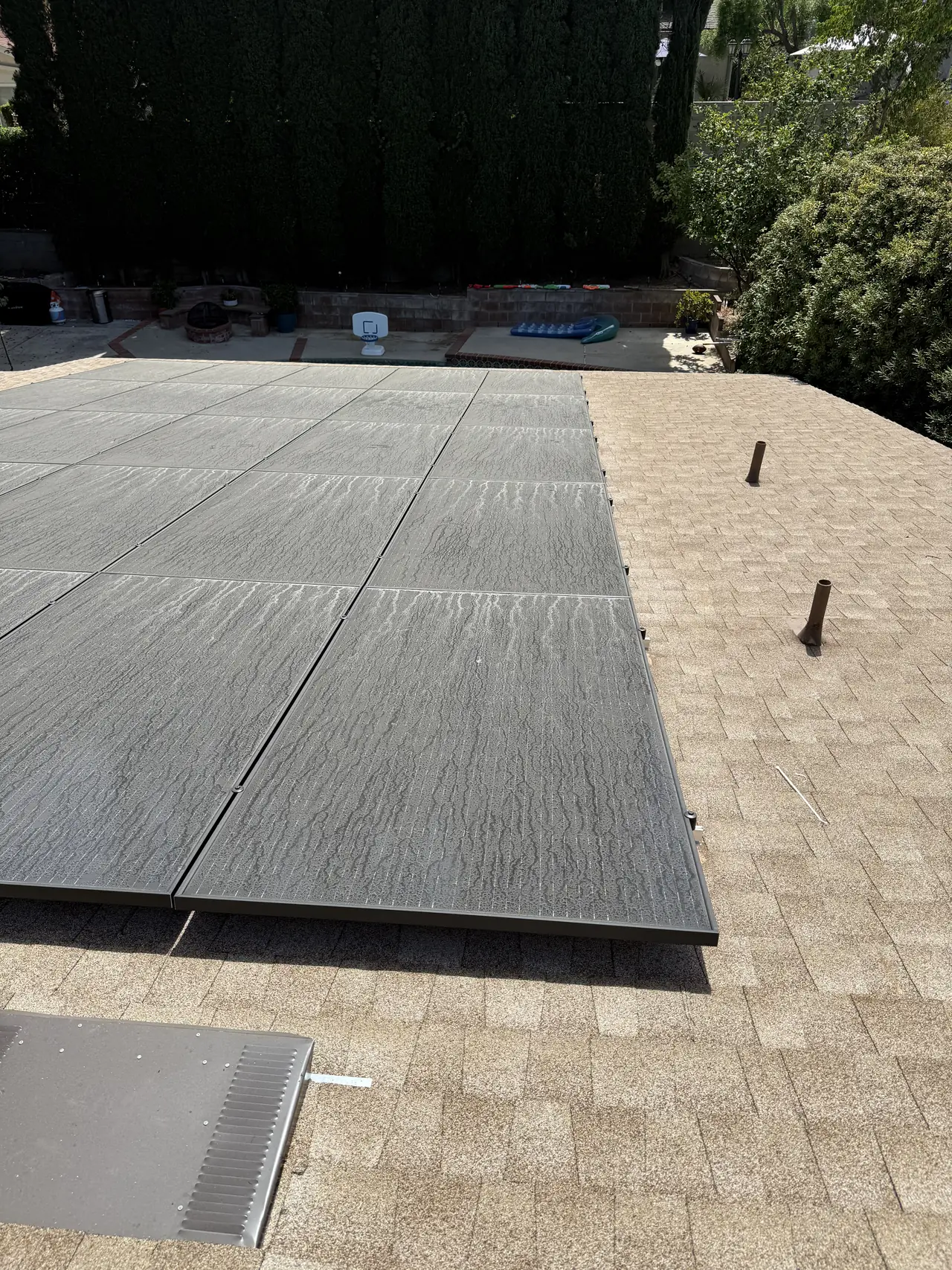 Large solar array across a composition shingle roof, Granada Hills