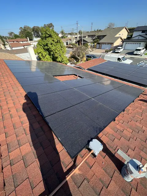solar panel array on a composition shingle roof in Lakewood, CA