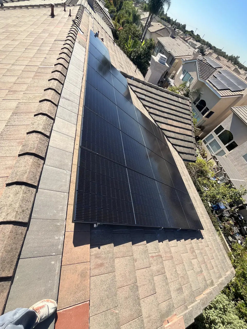 solar panel array on a composition shingle roof in Lakewood, CA