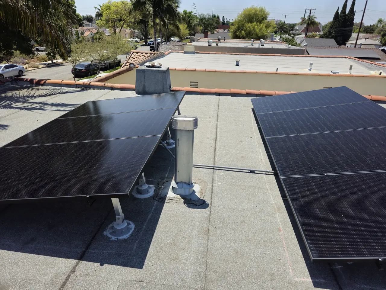 All-black solar array on tilted racking on a flat roof in Long Beach