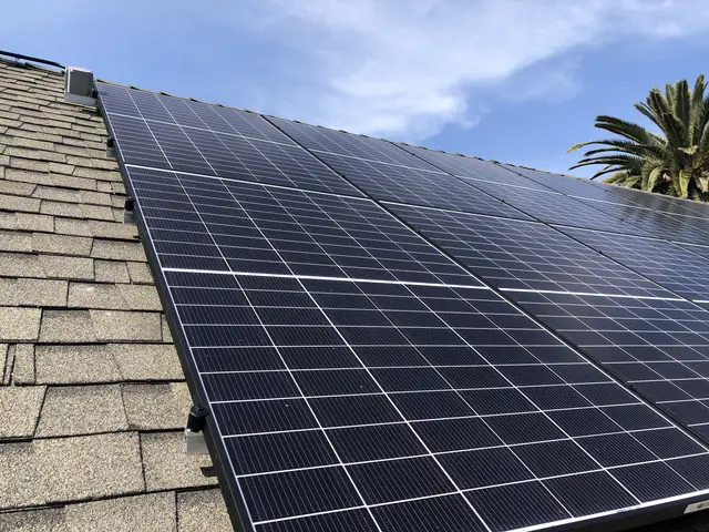 Solar panel mounting detail on a composition shingle roof in Long Beach, CA