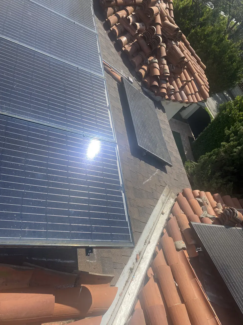 Solar panel mounting detail on a tile roof in Los Angeles, CA