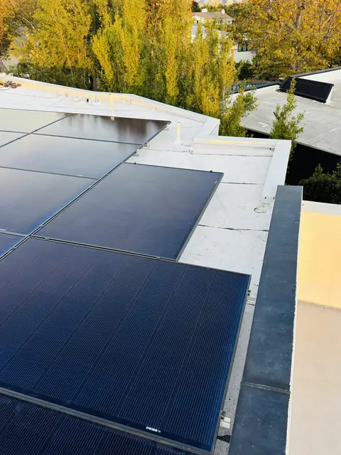 8.28 kW solar panel array on a flat roof in Los Angeles, CA