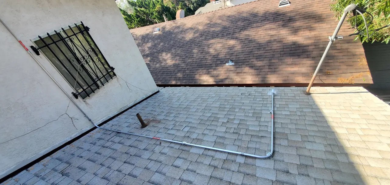 Conduit running down a roof slope to the wall below, Eagle Rock, Los Angeles