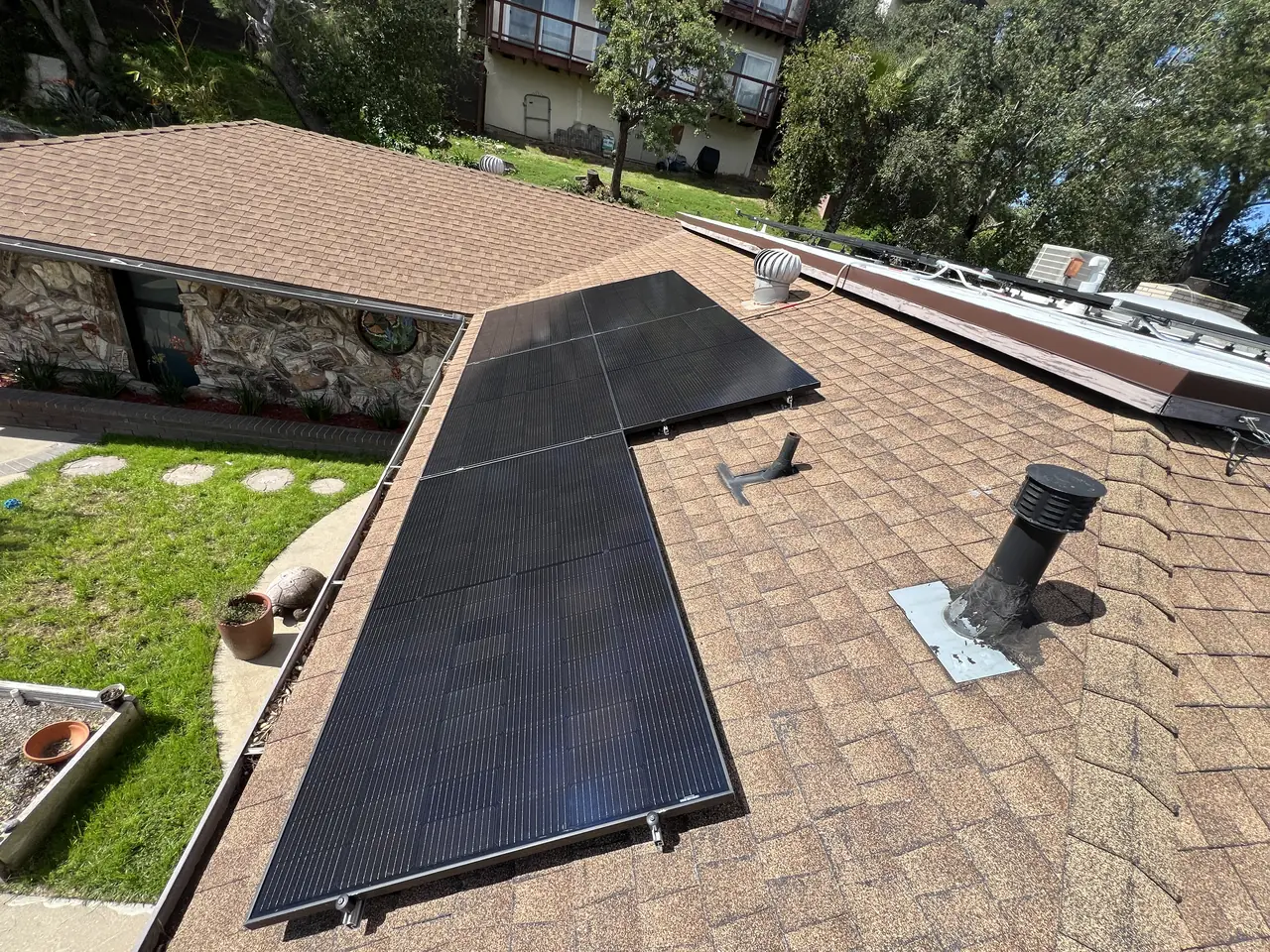 The array on the roof slope with the garden and the house below, Glassell Park, Los Angeles