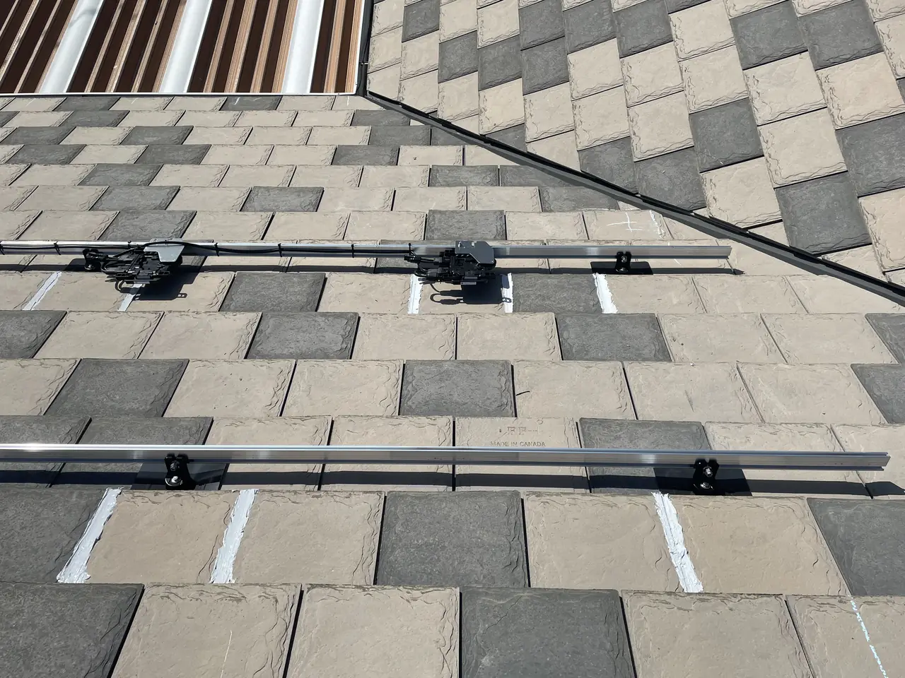 Mounting rails and attachments across a shingle roof, Beverlywood, Los Angeles