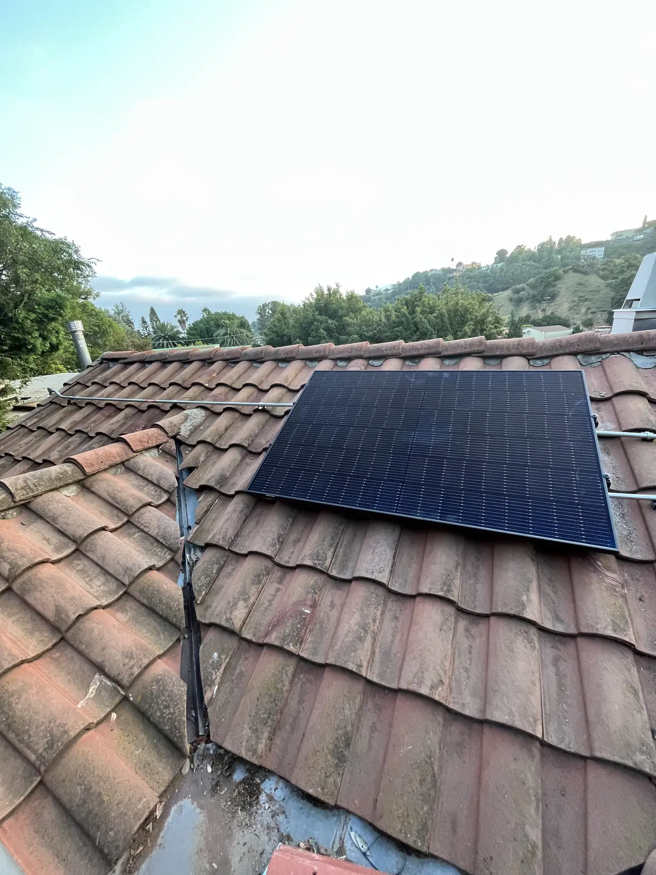 The array on the tile roof with the hills behind, Hollywood Hills, Los Angeles