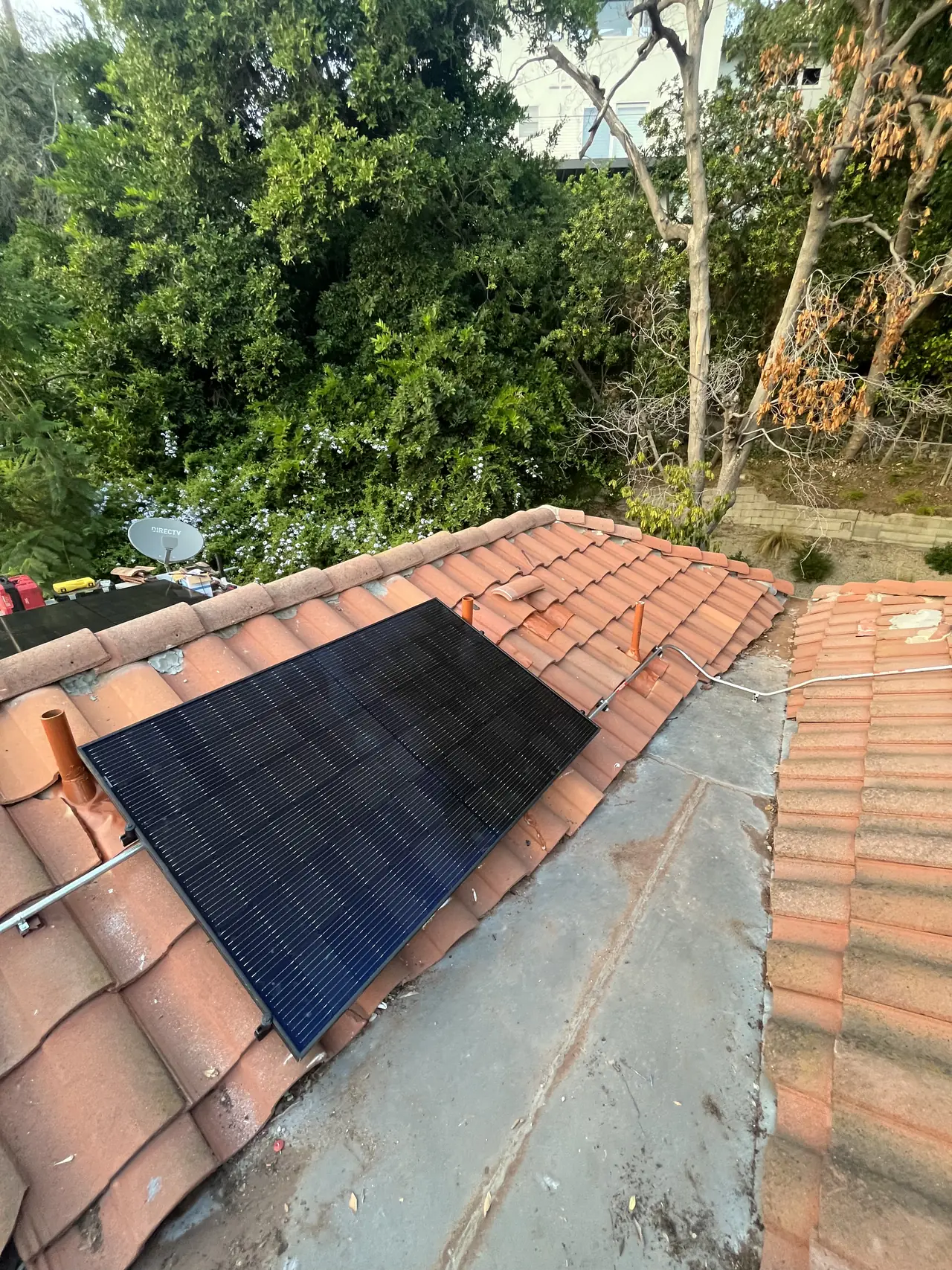 Modules on the tile roof among the trees, Hollywood Hills, Los Angeles