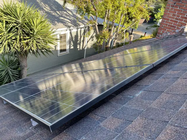 Solar panel mounting detail on a composition shingle roof in Los Angeles, CA