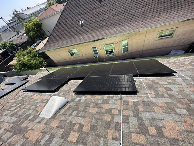 Solar panel mounting detail on a composition shingle roof in Los Angeles, CA