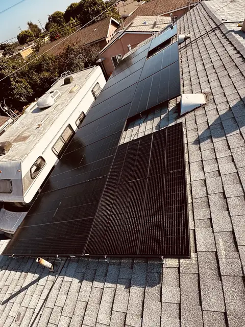 Solar panel mounting detail on a composition shingle roof in Los Angeles, CA